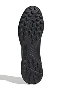 Black athletic shoe outsole featuring a textured pattern with traction nodes and the word "PREDATOR" embossed along the side.