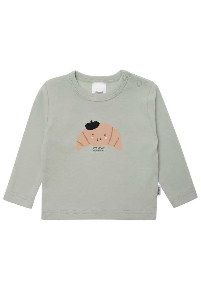 Langärmliges, mintgrünes Hemd aus weichem Baumwollstoff. Mit einem Croissant-Graphic mit einem lächelnden Gesicht und schwarzem Barett sowie einem Etikett am Kragen.