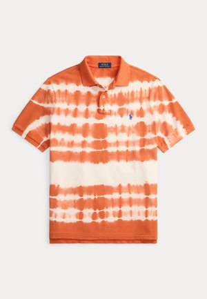 Polo à manches courtes avec effet tie-dye orange et blanc, col à boutons et logo brodé sur la poitrine. Matière en coton doux.