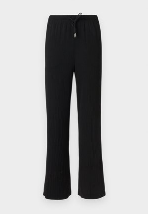 Μαύροι ριμπ καμπάνα παντελόνια με ελαστική μέση και μαύρο κορδόνι, εμφανιζόμενα πάνω σε απλό φωτεινό φόντο.