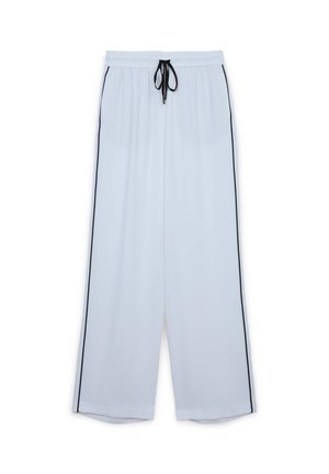 Lightweight white pants in a loose fit with black side stripes. Elastic waistband with a drawstring for adjustable comfort. Smooth texture.