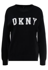 Černá mikina vyrobená z měkké bavlněné tkaniny, s bílým logem "OKNY" přes hrudník, s žebrovanými manžetami a kulatým výstřihem.