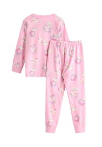 Rosa pyjamaset i bomull med långärmad topp och byxor med ett lekfullt mönster av enhörningar och moln. Byxorna har elastisk midja.
