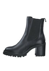Black leather ankle boot with elastic side panels, chunky heel, and textured sole. Smooth finish with minimal stitching details.