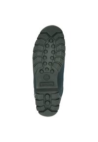 Suola di scarpa in gomma nera con modelli di battistrada profondi, incisioni circolari e angolari, e logo Timberland in rilievo nell'area del tallone.
