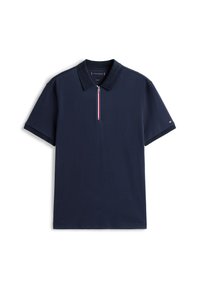 Polo-shirt bleu marine en coton, avec un col zippé orné d'accents rouge, blanc et bleu, et des manches courtes.