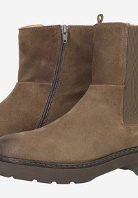 Bottines en suede marron avec fermeture éclair sur le côté, panneau élastique et semelle en caoutchouc texturé. Bout arrondi et détails de couture renforcée.
