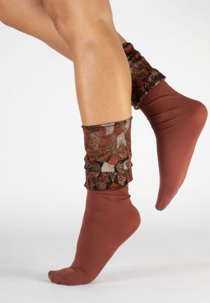 Was es beim Kauf die Socken orange zu beurteilen gilt