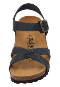 Sandalia de piel negra con correas cruzadas y hebilla ajustable, con plantilla de corcho marrón y suela de goma texturizada, tamaño 37.