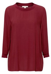 Bluzka z długim rękawem w kolorze burgundowym, wykonana z lekkiego materiału. Posiada okrągły dekolt i marszczone mankiety. Gładka tekstura oraz luźny krój.