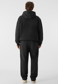Lost Youth CORE COMFORT - Spodnji deli trenirk - black