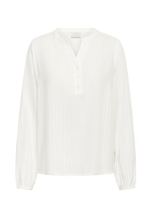 Valge pikkade varrukatega pluus, millel on peened vertikaalsed triibud, ümar V-kaelus ja kolm eesmist nupuvajutust.