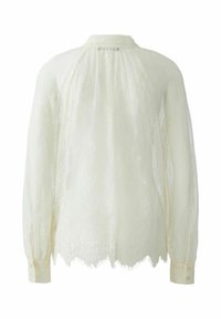 Kanten blouse in zacht ivoor, met een ronde kraag en lange mouwen met knopenmanchetten. Doorzichtige textuur met bloemmotieven en een scalloped zoom.