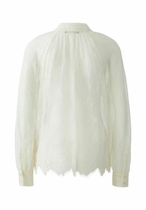 Kanten blouse in zacht ivoor, met een ronde kraag en lange mouwen met knopenmanchetten. Doorzichtige textuur met bloemmotieven en een scalloped zoom.
