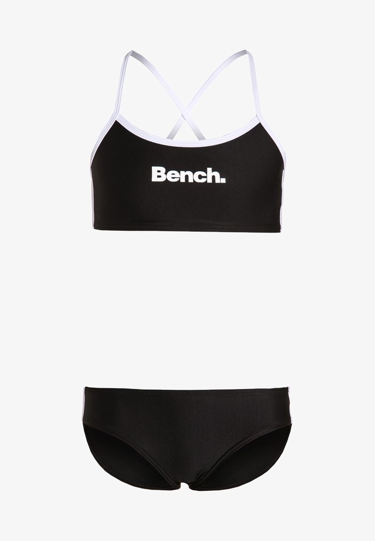 Čierny bikiny set s crop topom s bielym lemovaním a nastaviteľnými kríženými ramienkami, spolu s ušľachtilými spodnými časťami bikín s nízkym pásom.