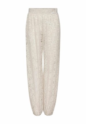 Pantalon en dentelle blanche avec taille et poignets élastiques, présentant un motif floral et un design semi-transparent.