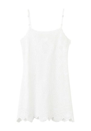 Vestido sin mangas de encaje blanco con tirantes finos ajustables y detalle de dobladillo ondulado.