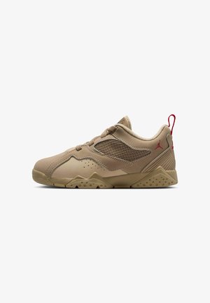 Tan sneaker featuring a mesh upper, textured accents, rubber sole, and a red logo on the heel. Low-cut design with rounded toe.