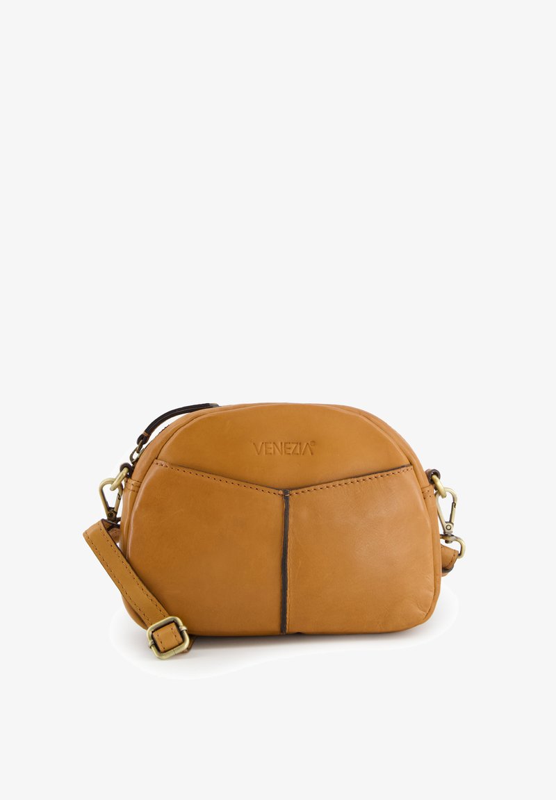 Small tan leather crossbody bag with front pocket, black seam details, gold-tone clasps, and embossed "VENEZIA" logo on white background.