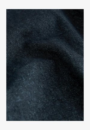 Dark blue denim fabric with a subtle sheen, featuring a smooth texture and consistent weave. No visible patterns or accents.