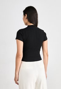 Calvin Klein Jeans VARIEGATED HALF ZIP - Basic póló - black