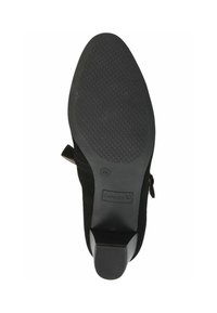 Suola di scarpa con tacco in suede nero, con superficie in gomma testurizzata, dotata di un tacco a blocco basso e di un'etichetta con la scritta "CAPRICE."