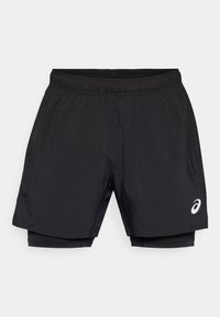 Black athletic shorts with an elastic waistband, featuring a lightweight outer layer and integrated compression lining. Small logo detail on side.