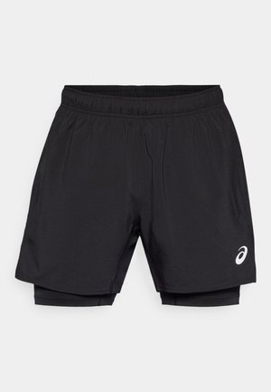 Black athletic shorts with an elastic waistband, featuring a lightweight outer layer and integrated compression lining. Small logo detail on side.