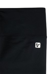 Leggings atletici neri realizzati in un tessuto liscio ed elastico con una piccola toppa con logo bianco sull'anca e cuciture flatlock.