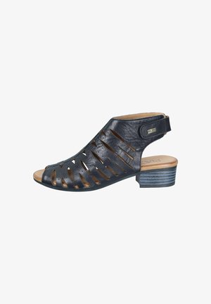 Black leather open-toe sandal with laser-cut slits, adjustable ankle strap, and low stacked heel.