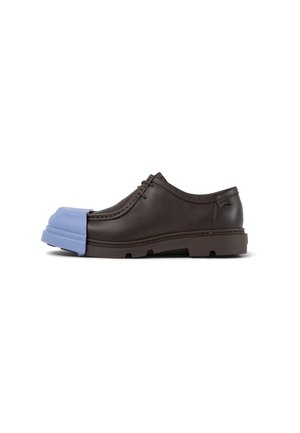 Brown leather shoe with rounded toe, featuring a blue rubber accent on the front, textured sole, and stitched detailing.