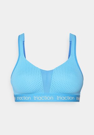 Bra sport albastru cu textură din plasă și bretele late. Prezintă un design triangular și o bandă elastică cu branding "triaction".