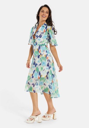 Floral midi dress in lightweight fabric, featuring a multi-colored abstract pattern, short sleeves, a tie waist, and a flowing silhouette.