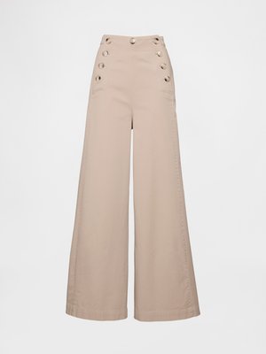 Wide-legged beige trousers made of cotton, featuring a high waist, large front pockets, and decorative buttons on the side.