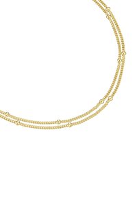 Kullatooni kaelakee, millel on kolm nööri keerutatud disainiga ja siledad ovaalsed aktsendid, mis on ahelate vahel ühtlaselt jaotatud.