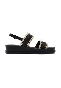 Sandales à plateforme noires avec des brides en tissu tressé comportant des accents beiges. Le design comprend une bride arrière ajustable et une semelle texturée.