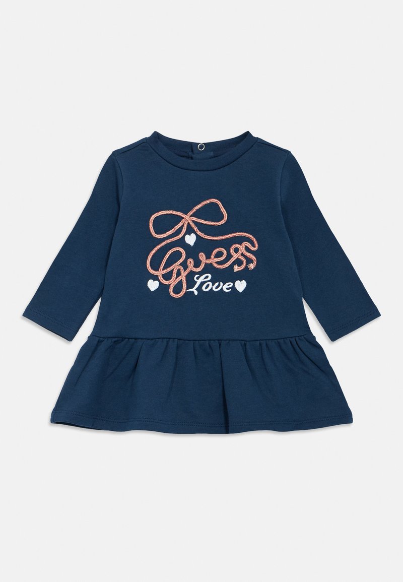 Μπλε σκούρο φόρεμα με μακριά μανίκια και φουσκωτή φούστα, με ροζ κεντημένο κείμενο που γράφει "Guess Love" και μικρές καρδιές. Απαλό βαμβακερό ύφασμα.