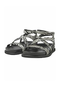 Zwart-witte sandalen met zebrapatroon, voorzien van kruisriemen, rubberen zool en verstelbare enkelband. Zachte textuur en open teenontwerp.
