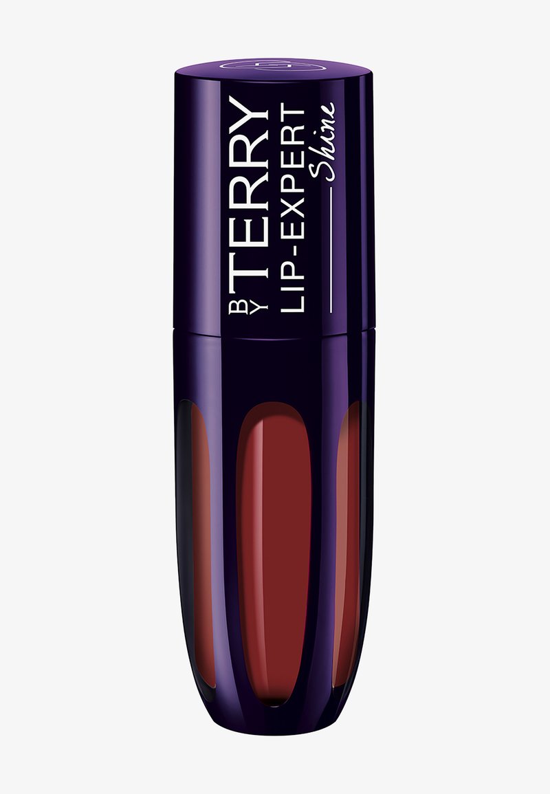 Liquid lip color in a dark burgundy shade, housed in a sleek, reflective purple bottle with transparent accents and white text labeling.