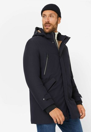 Navy parka with a hood, zippered front, chest and side pockets, soft lining, and adjustable cuffs. Smooth, water-resistant material.