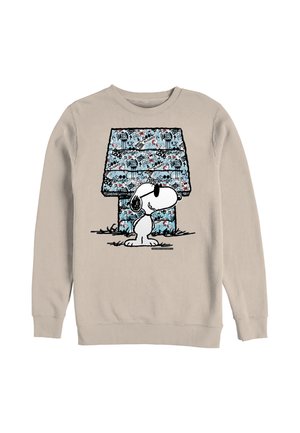 Felpa beige con Snoopy che indossa occhiali da sole, in piedi davanti a una cuccia blu coperta da motivi in stile graffiti neri e rossi.