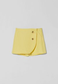 Yellow wrap-style skort with two brown buttons on the side and a clean, minimalist design.