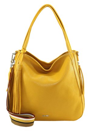 Sac à bandoulière en cuir jaune avec longues poignées, pompon décoratif sur le côté et une bandoulière en tissu rayée détachable.
