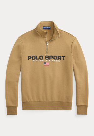 Tan zip-up sweatshirt made of soft material, featuring "POLO SPORT" and "RALPH LAUREN" in bold black text with an American flag accent.
