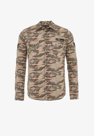 Camo-gepatroneerde langetermijn shirt in beige, groene en bruine tinten; voorzien van twee borstzakken en een zwart label op de mouw.