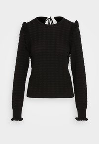 Pull noir en maille avec un motif zigzag texturé, manches longues ornées de volants et fermeture nouée au niveau de l'encolure arrière.