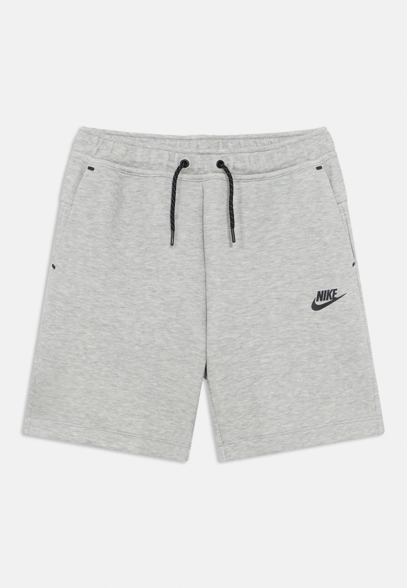 Shorts en coton gris à texture lisse, taille élastique, cordon de serrage noir et poches latérales. Présente un logo Nike noir à l'avant.