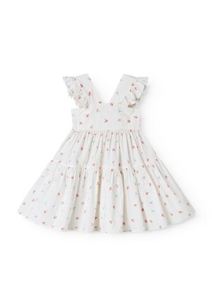 Robe blanche sans manches avec bretelles volantées et petit imprimé floral rouge et bleu, taille froncée et jupe à volants.