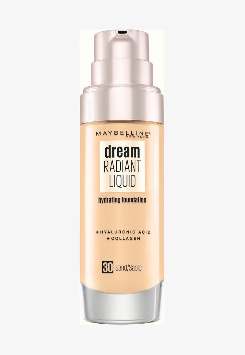 Fond de teint hydratant Maybelline Dream Radiant Liquid en couleur Sable. Flacon pompe avec un corps en verre givré de couleur beige et un capuchon argenté. Contient de l'acide hyaluronique et du collagène.