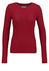 Röd stickad tröja med långa ärmar, rund halsringning och texturerad kabeldesign. Ribbstickade muddar och nederkant fulländar looken.